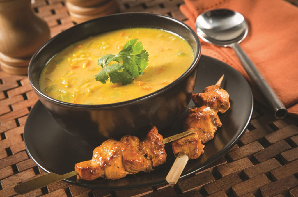 Broth with chicken skewers