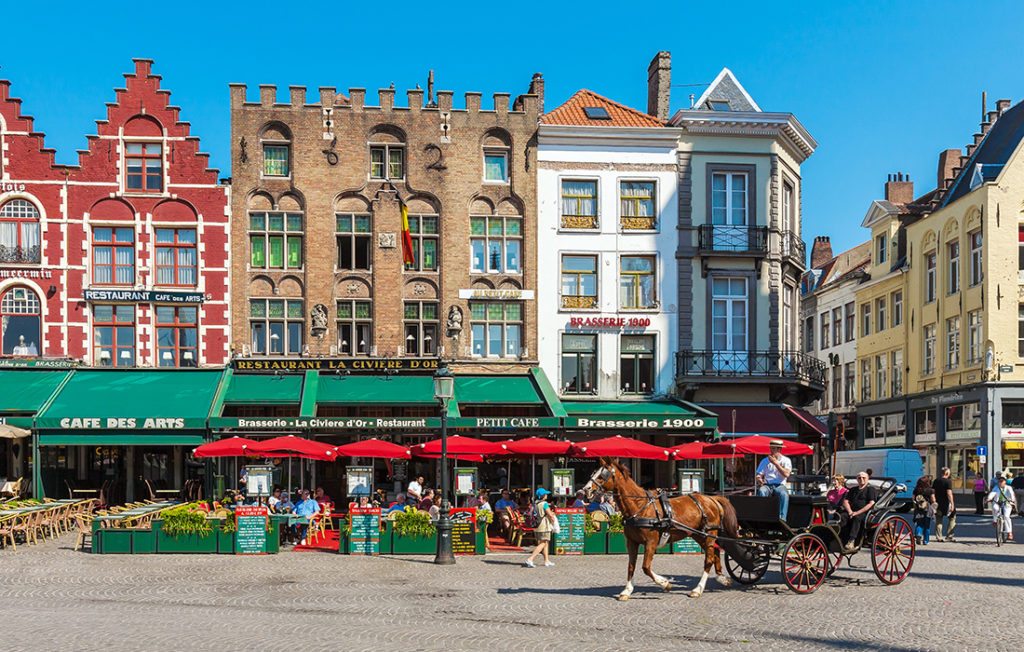 Horse-drawn carriage on the Grote Markt. Top romantic destinations in Europe