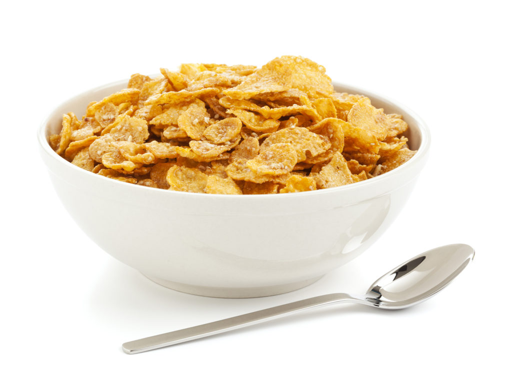 Bowl of cornflakes and silver spoon