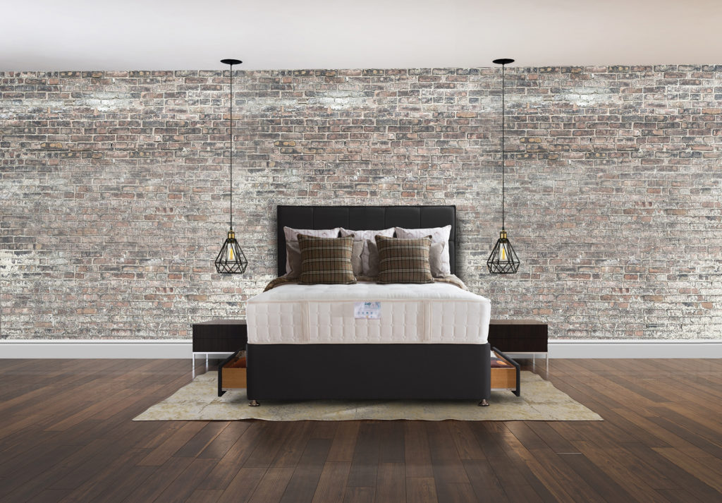 Bedroom with concrete brick wall and wooden floor