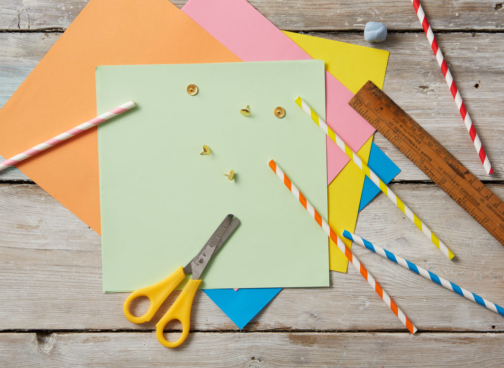 Material to make pinwheels - coloured paper squares, paper straws, drawing pins, ruler, scissors