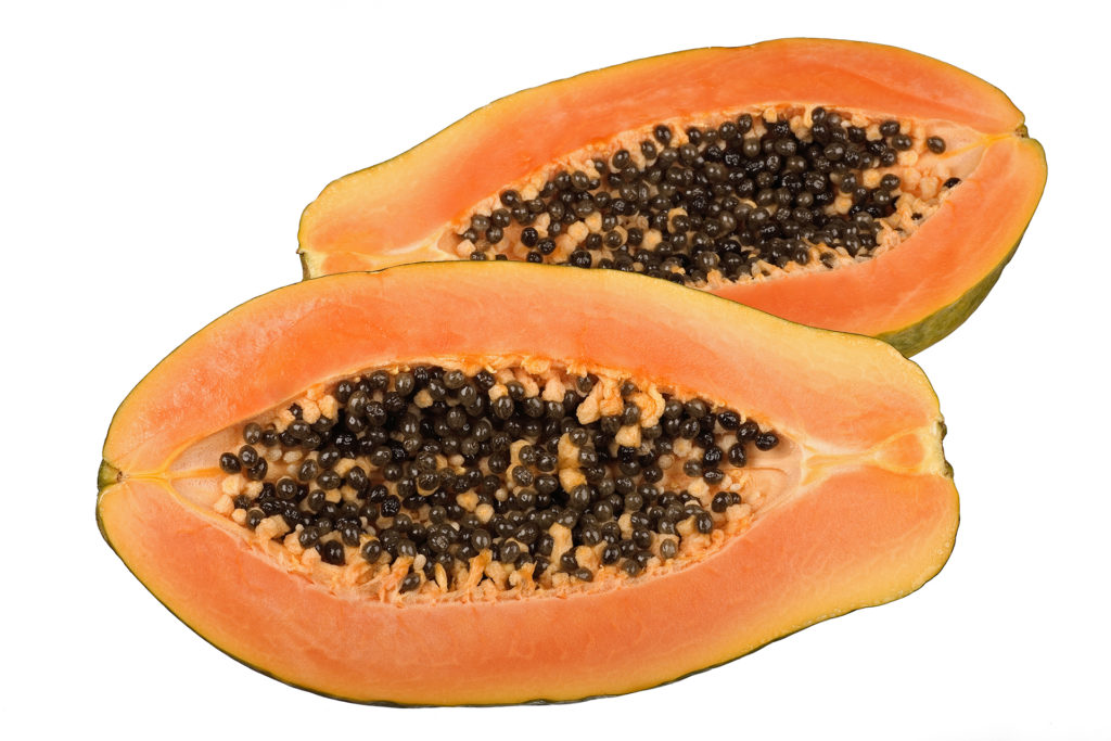 papaya halves isolated on white background
