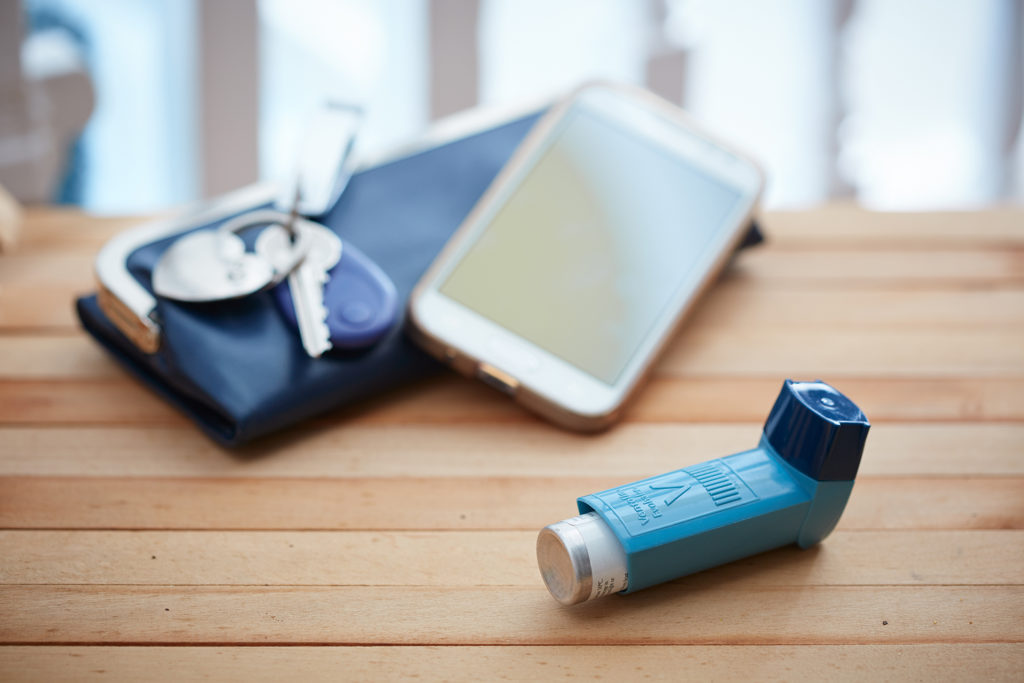 Asthma inhaler, phone and keys