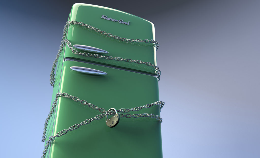 Chains and padlock on green fridge.