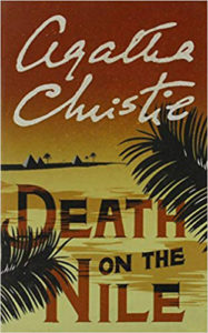 Cover of Agatha Christie's Death On The Nile, palm fronds, desert and dark reddish sky