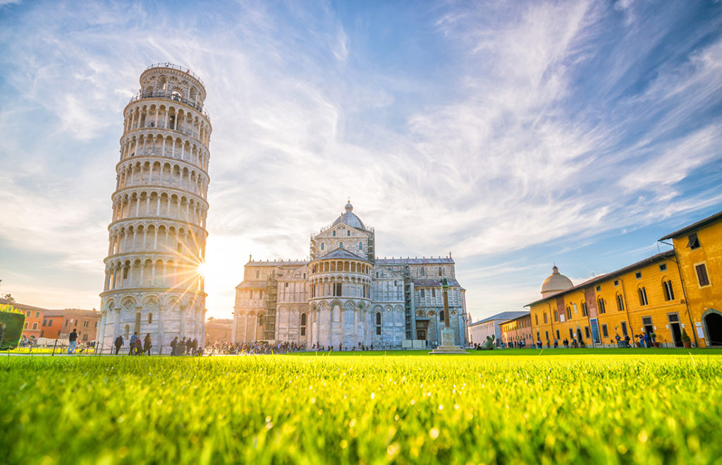 Pisa Cathedral and the Leaning Tower in a sunny day in Pisa, Italy.; Shutterstock 