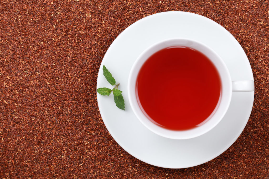 Red tea in white tea cup