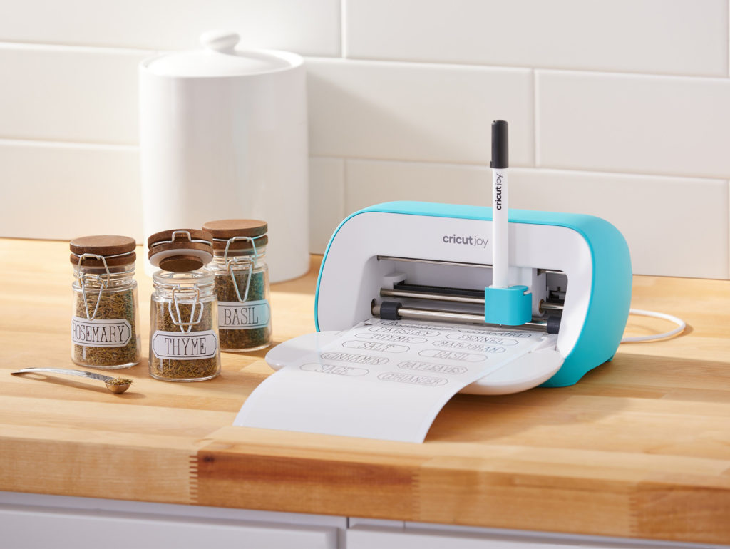 Cricut Joy machine printing out labels for spice jars