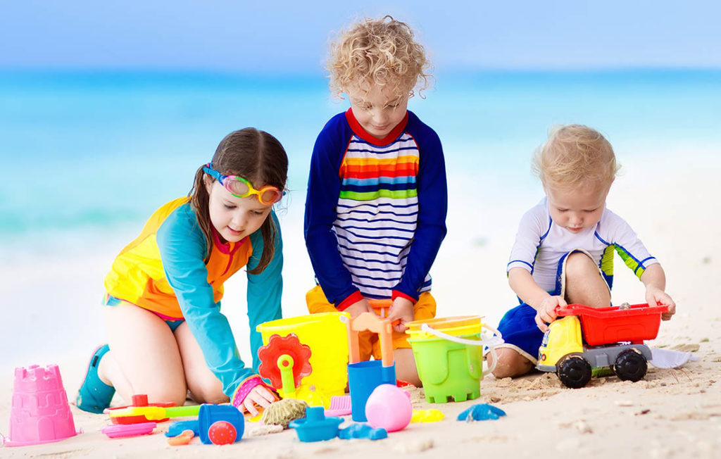 Kids playing with toys at beach abroad Pic: Shutterstock