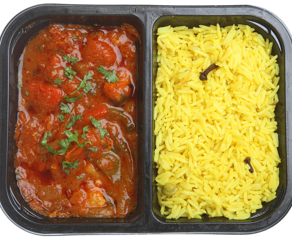 Indian chicken curry with rice in supermarket packaging tray.;