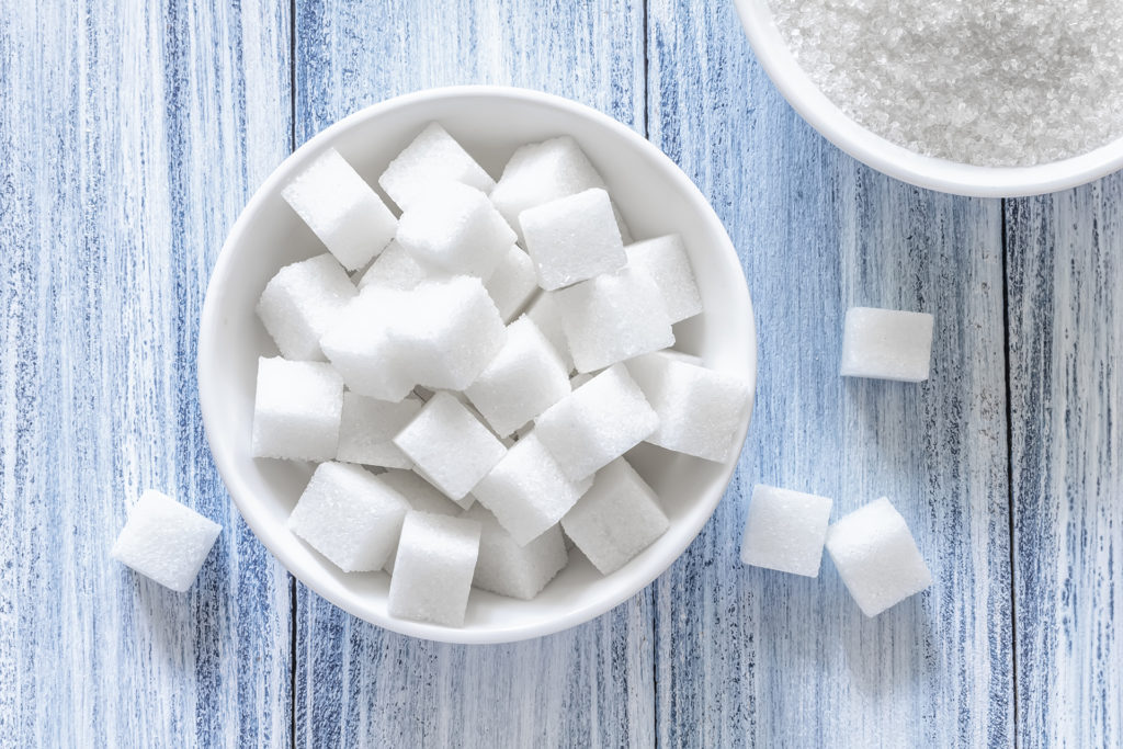 Cubes of sugar in a white dish
