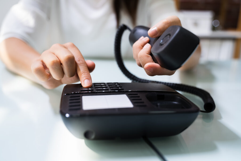 Businesswoman Hand Making Landline Telephone Call Pressing Button; 