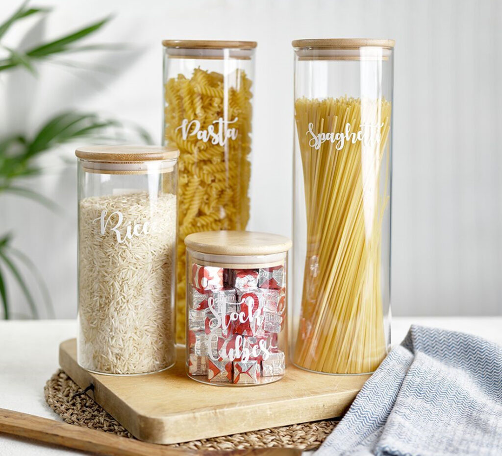 Glass jars with pasta, rice and spaghetti in them